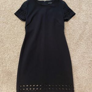 Form fitting cocktail dress with cutouts